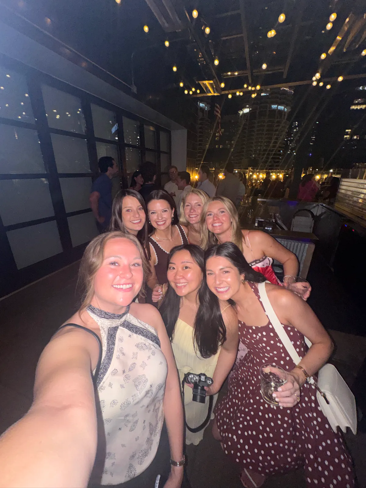Kaitlyn and a group of friends squeezed into a selfie on a night out